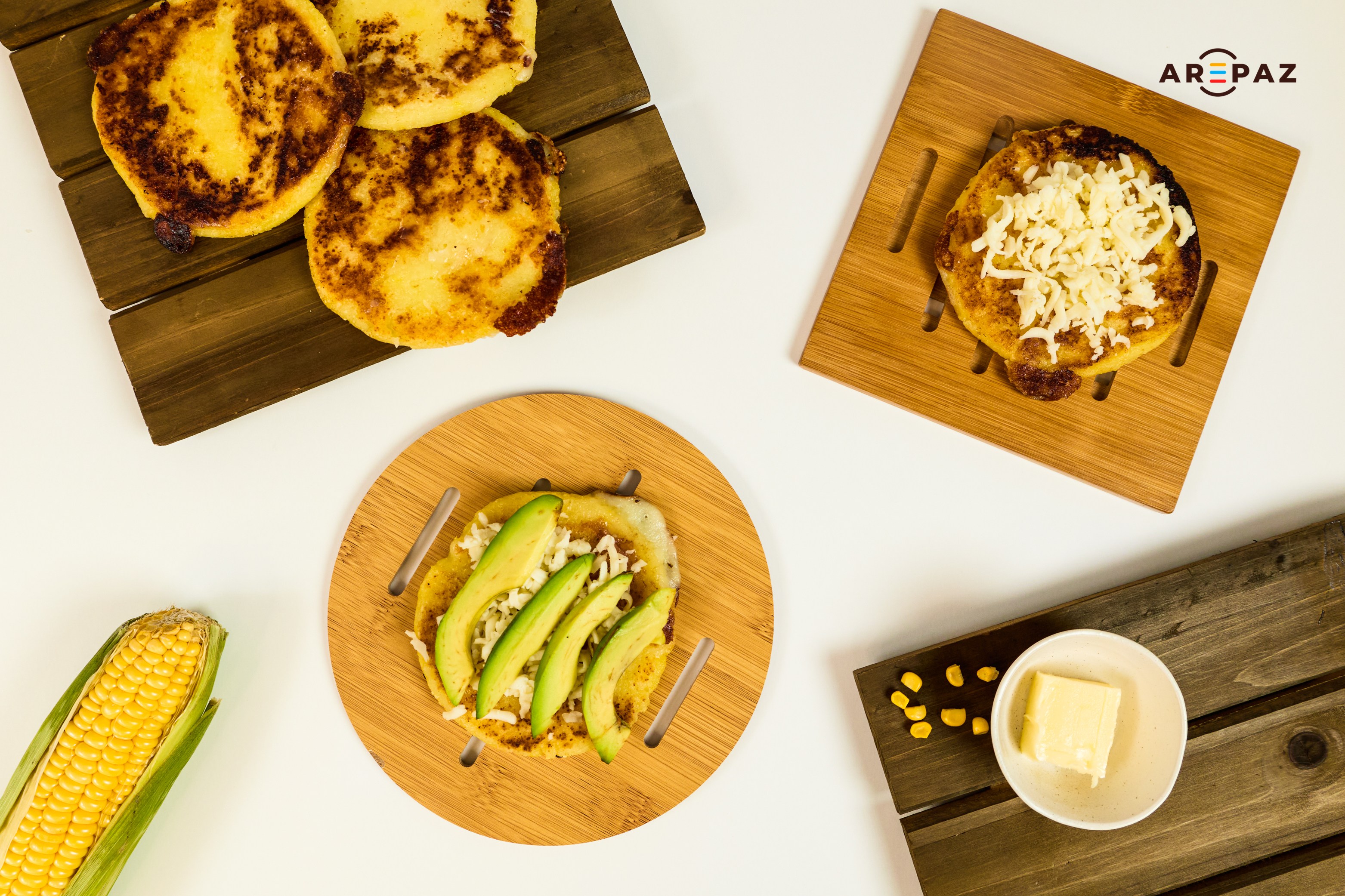 Variety of arepa preparations with avocado and cheese